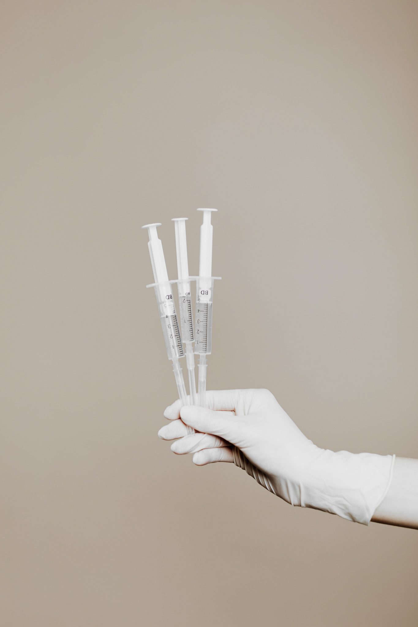 Image of hand holding needles